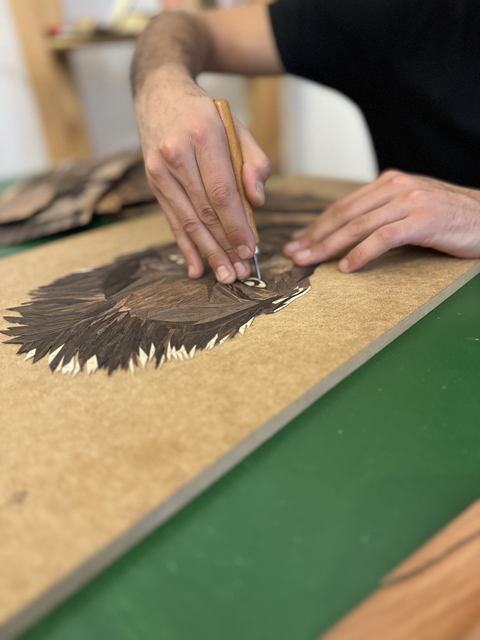 Sasun Sargsyan cutting veneer by hand in the studio