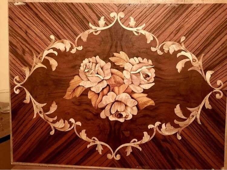 Floral cartouche on sunburst veneer
