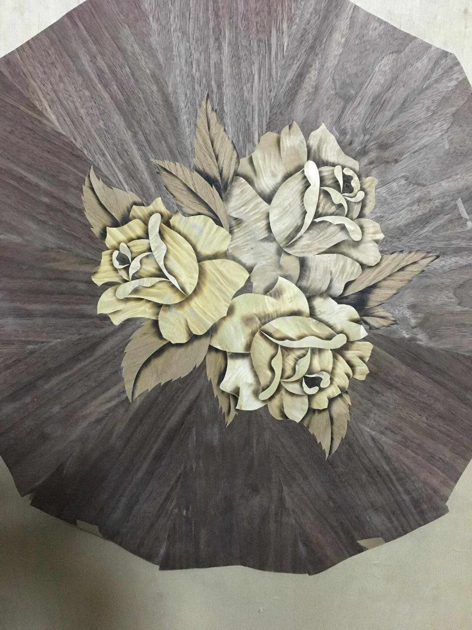 Marquetry work in progress in the workshop, before trimming